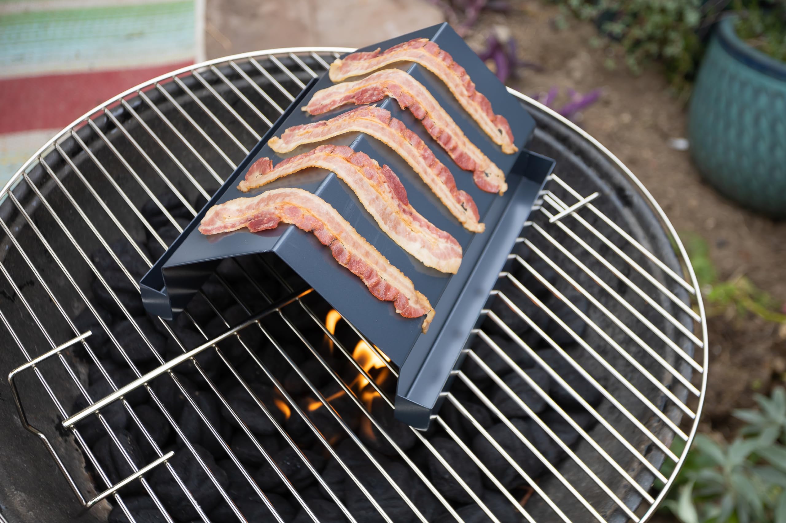 Outset rack beside utensils showing 8.5x10x5-inch size for small grills
