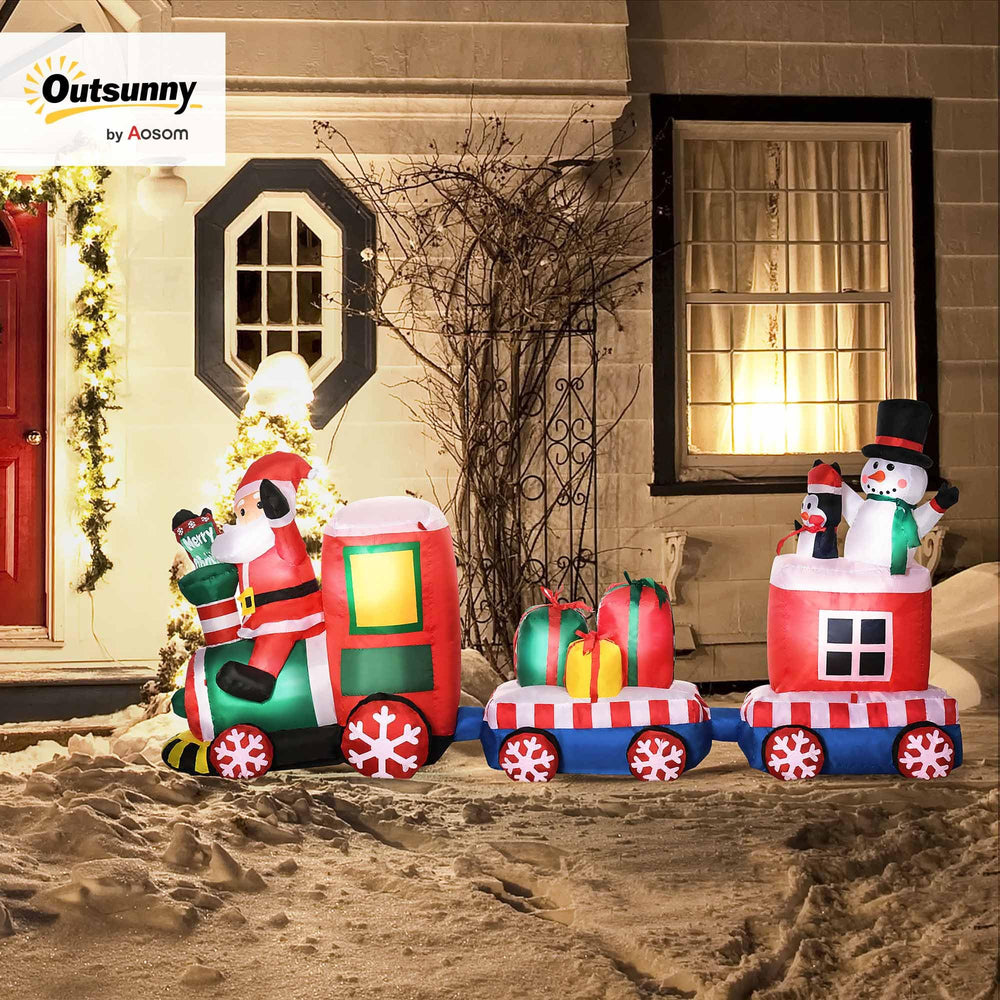 Outsunny train lit with internal LEDs brightening a yard at night