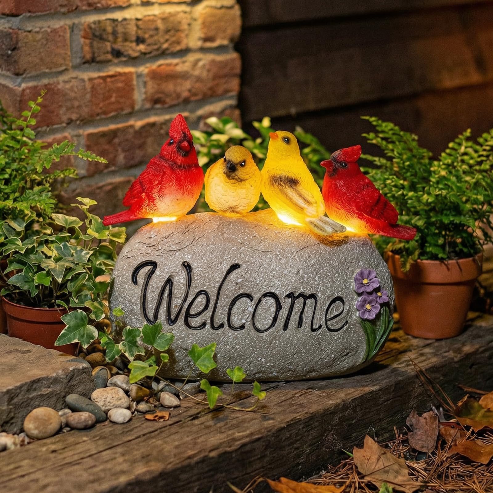 Ovewios garden at night with warm glow enhancing pathway ambiance