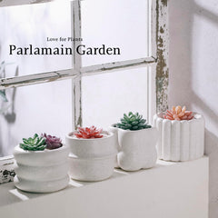Parlamain planters on a windowsill with herbs showing compact size and easy indoor use