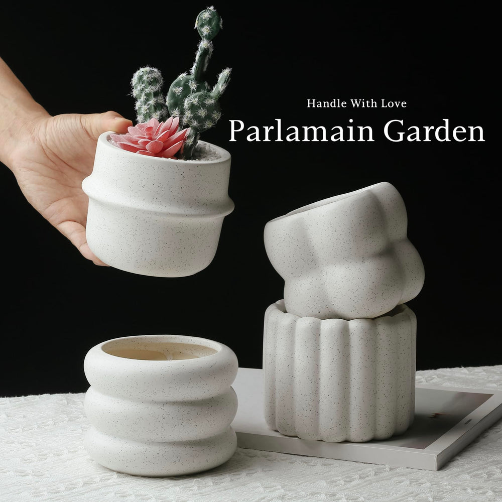 Parlamain planters held in hand to show scale and portability for small-space styling