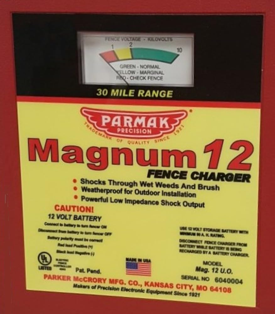 Parmak MAG12-UO next to a battery for scale showing compact design and easy installation