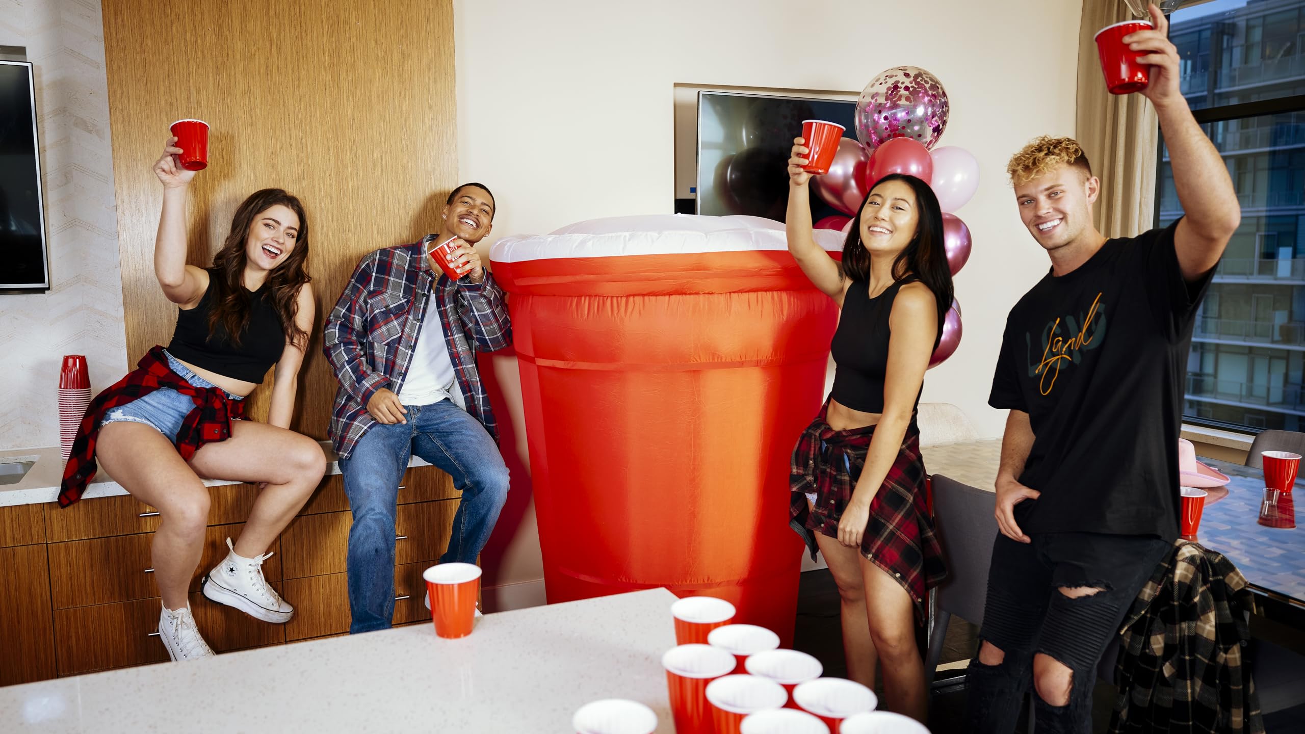 Party Poofer staked on lawn with ropes and water bags for steady outdoor stability
