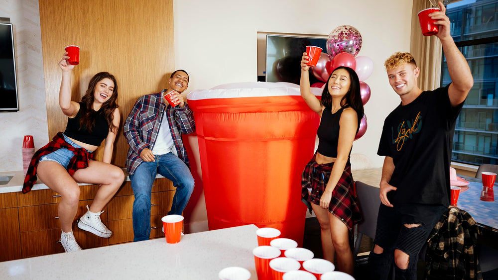 Party Poofer staked on lawn with ropes and water bags for steady outdoor stability