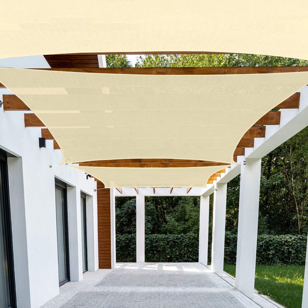 Patio front view of beige 10x12 shade sail showing full canopy coverage benefit