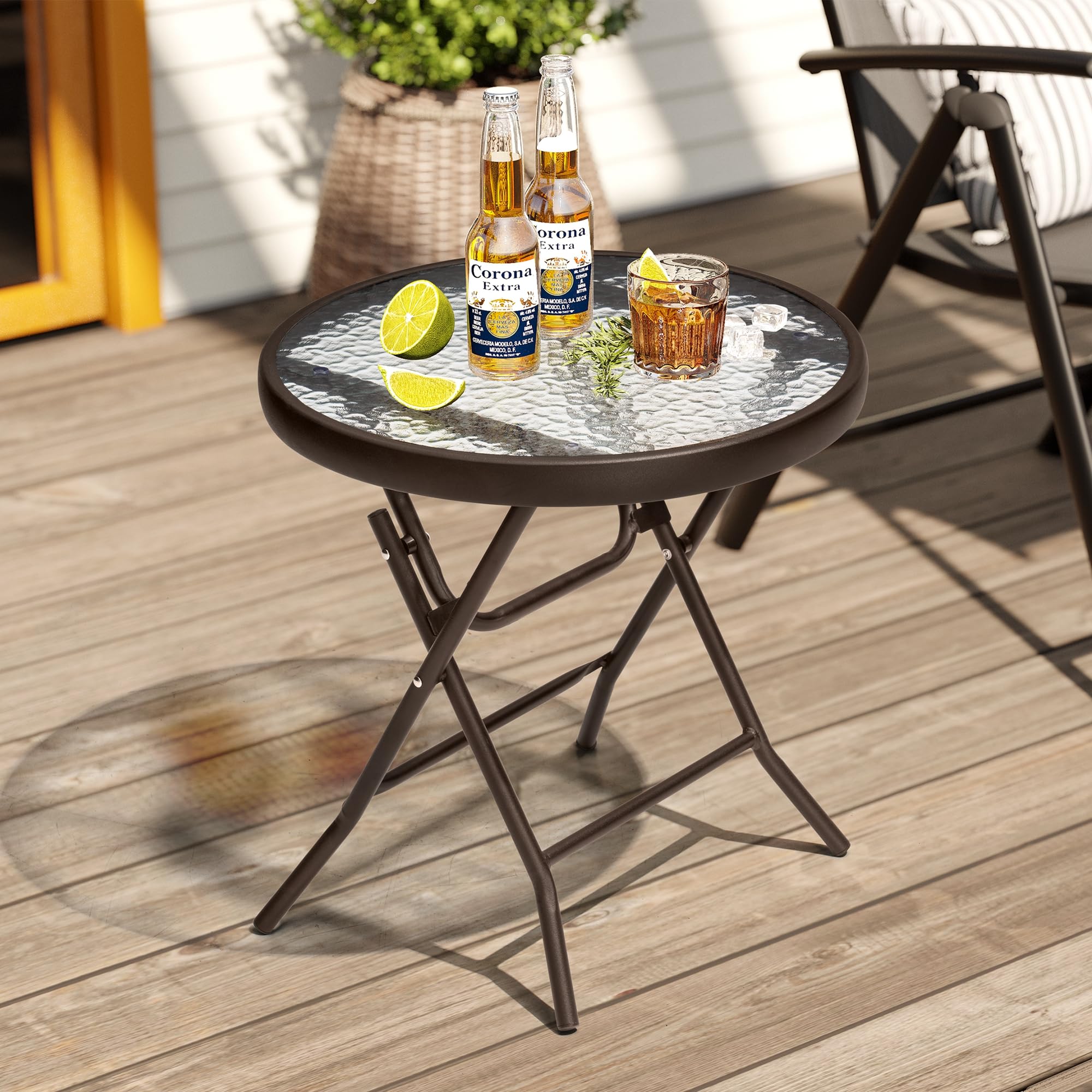 PATIOHIT folded table being carried showing lightweight portability