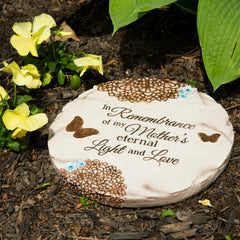 Pavilion Gift Company memorial stone placed in a garden bed, adds a peaceful focal point