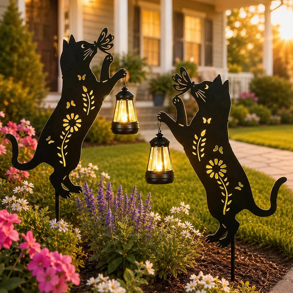 Pawatee front view showing two metal cat silhouette stakes and lanterns, decorative appeal
