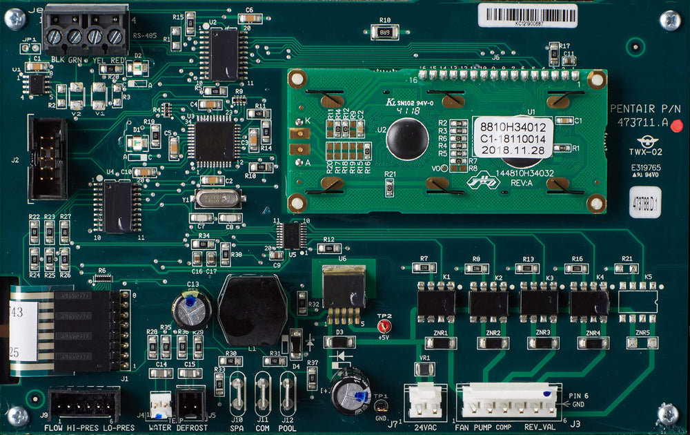 Pentair control board size comparison next to coin showing compact footprint for service planning