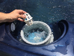 Periodic Products SpaPak placed in skimmer demonstrating easy drop‑in maintenance