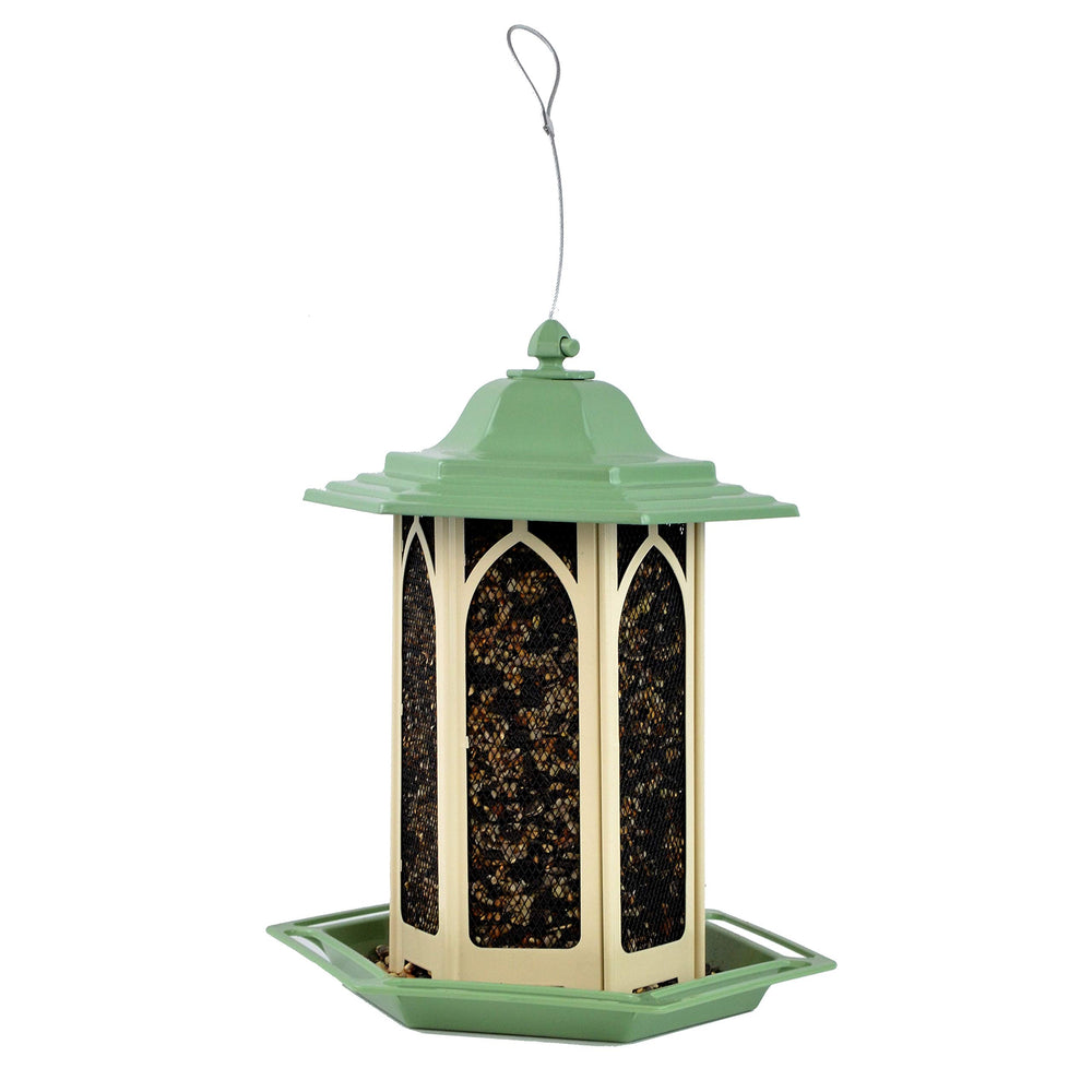 Perky-Pet pistachio installed in garden inviting songbirds in a backyard setting
