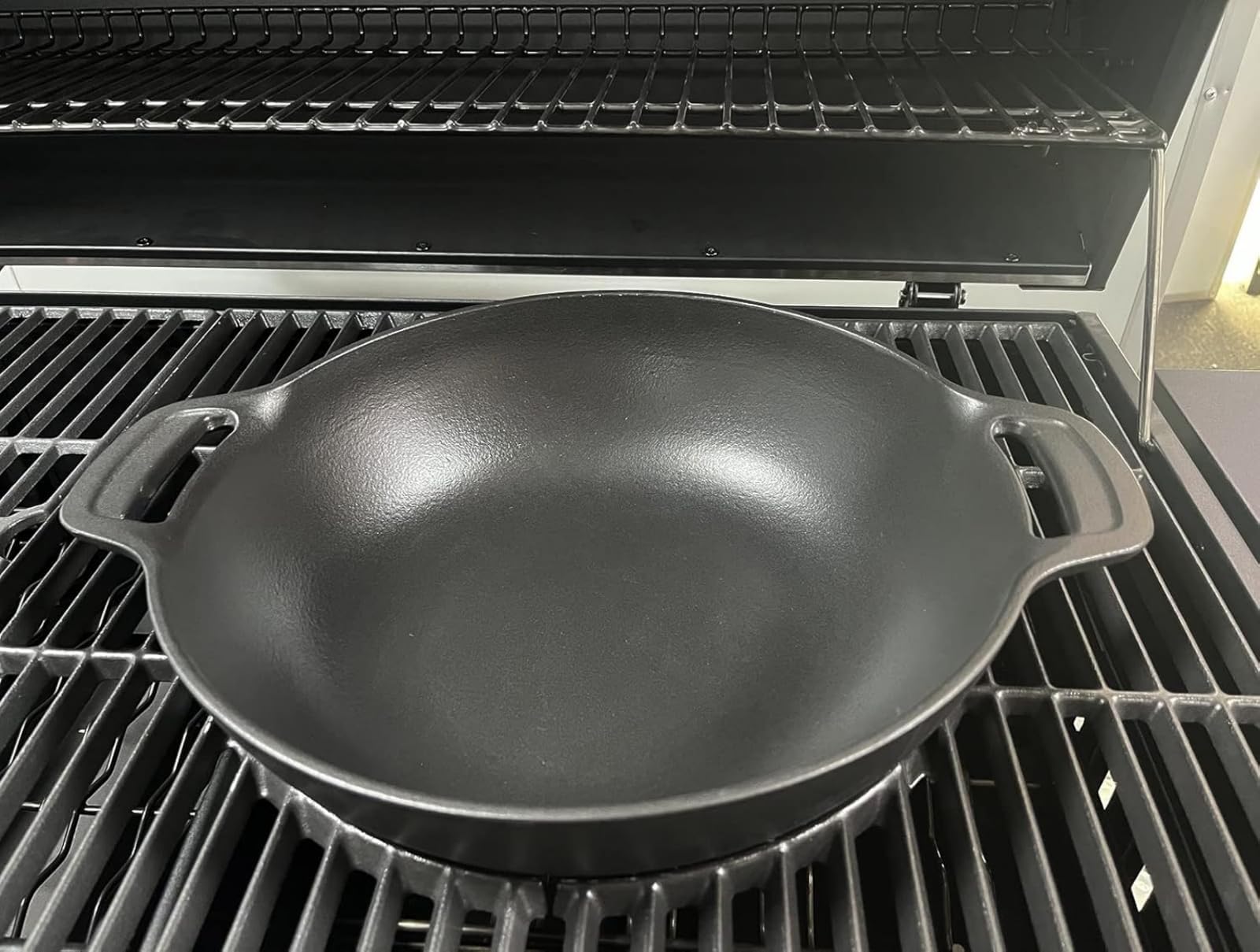 PETKAO wok on backyard grill with plated meal highlighting outdoor entertaining use