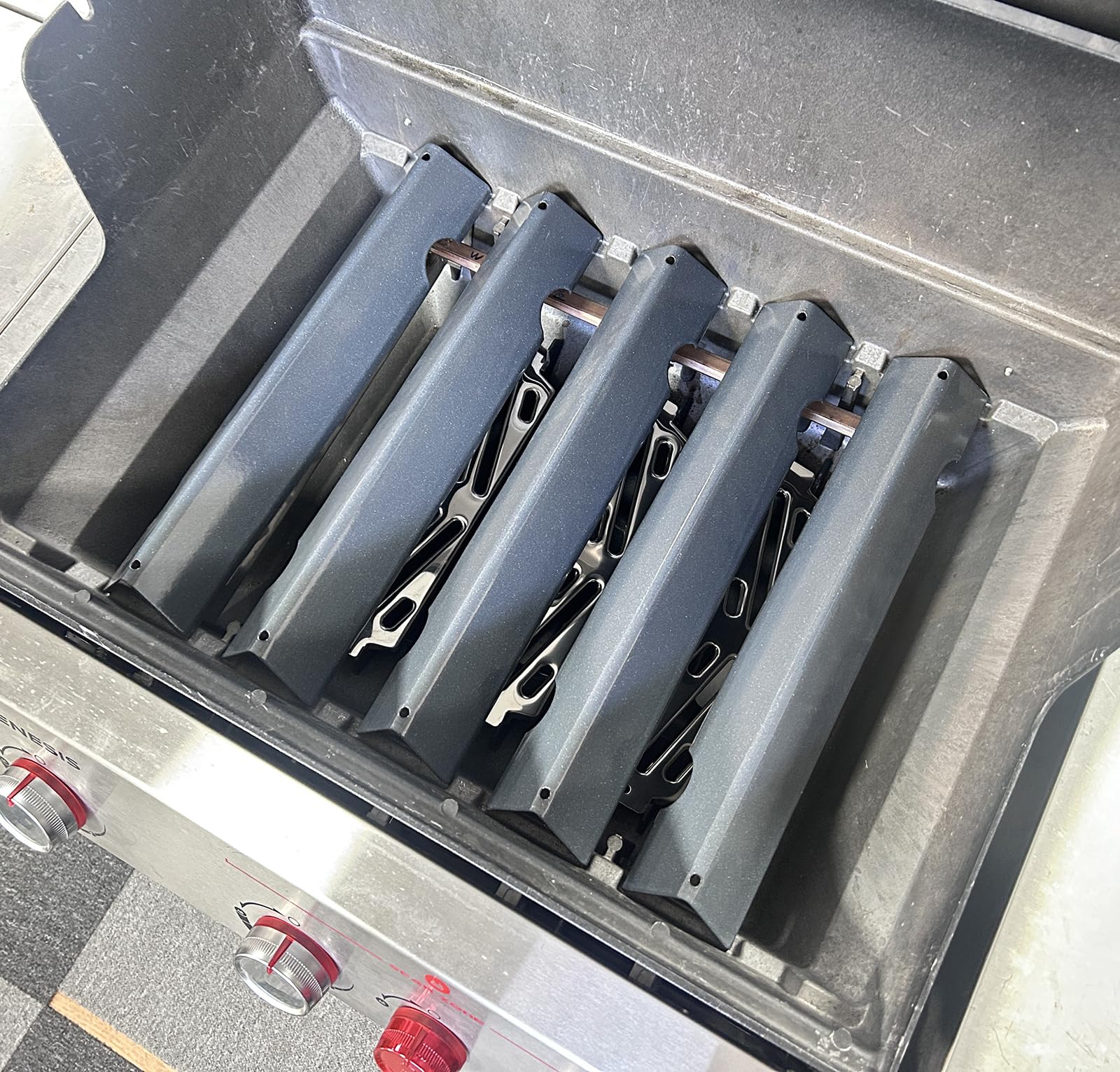 PETKAO heat deflectors placed under burners protecting firebox