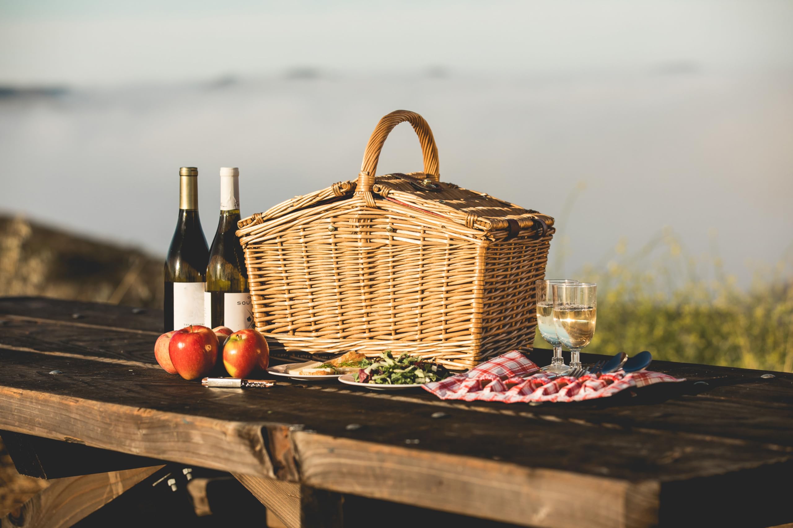 PICNIC TIME couple using basket outdoors showing romantic picnic setup benefit