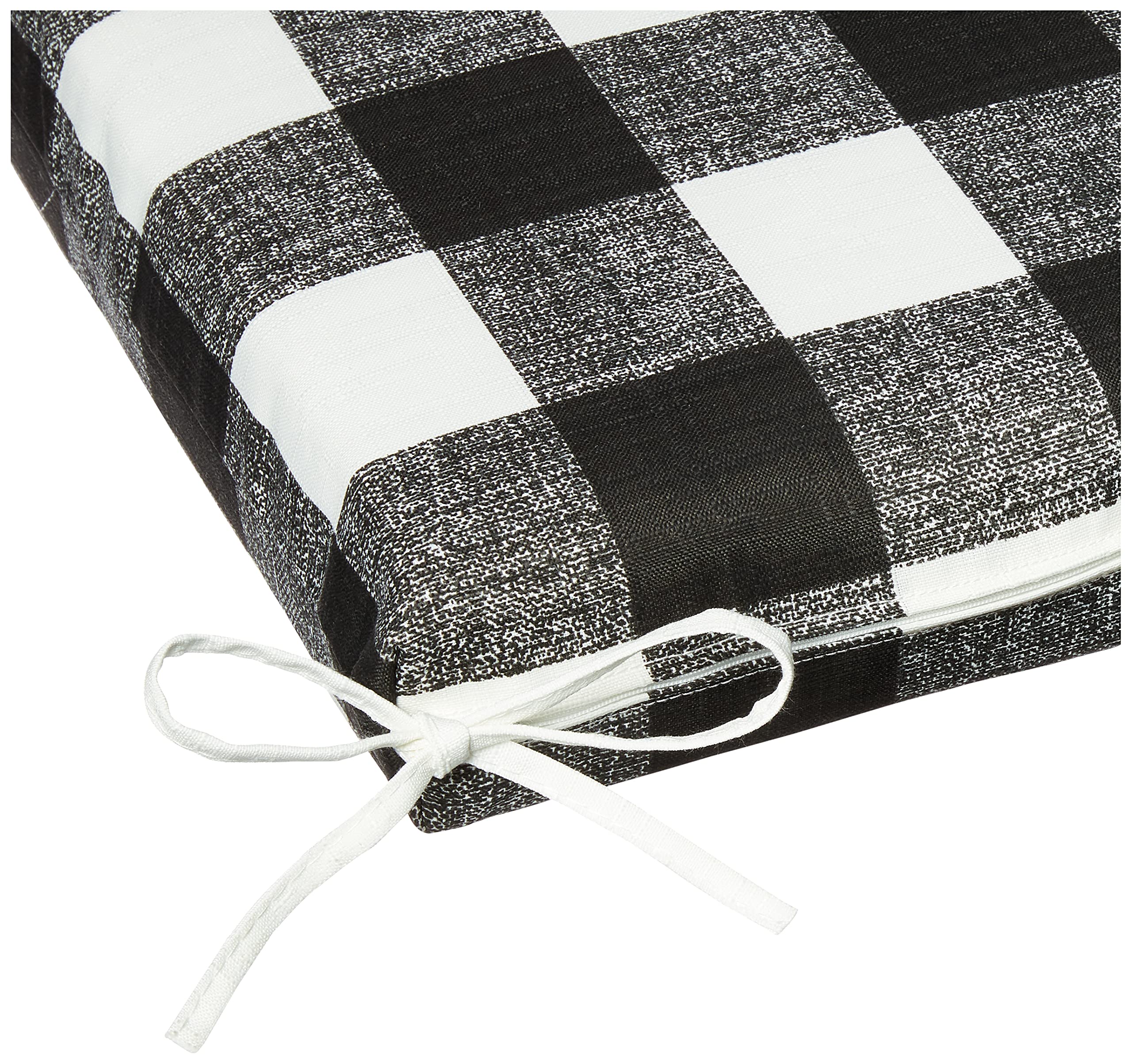 Pillow Perfect cushion in use on a porch bench demonstrating comfort and weather-ready style