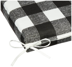 Pillow Perfect cushion in use on a porch bench demonstrating comfort and weather-ready style