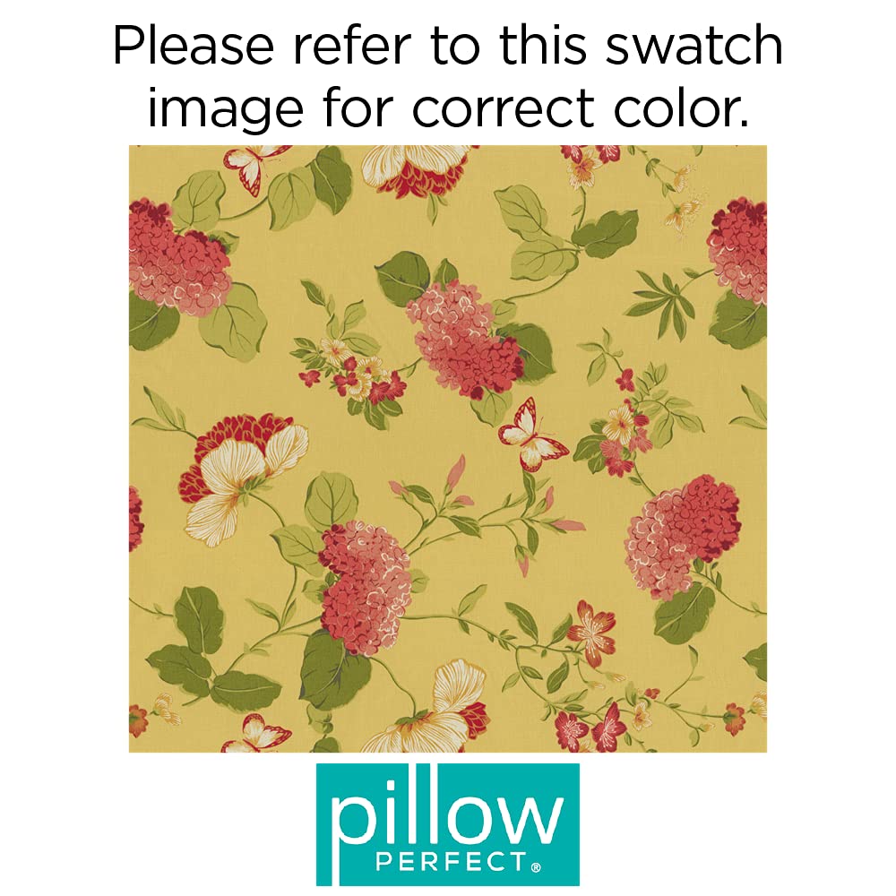 Pillow Perfect cushion placed on wicker chair in patio setting enhances outdoor relaxation