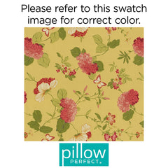 Pillow Perfect cushion placed on wicker chair in patio setting enhances outdoor relaxation
