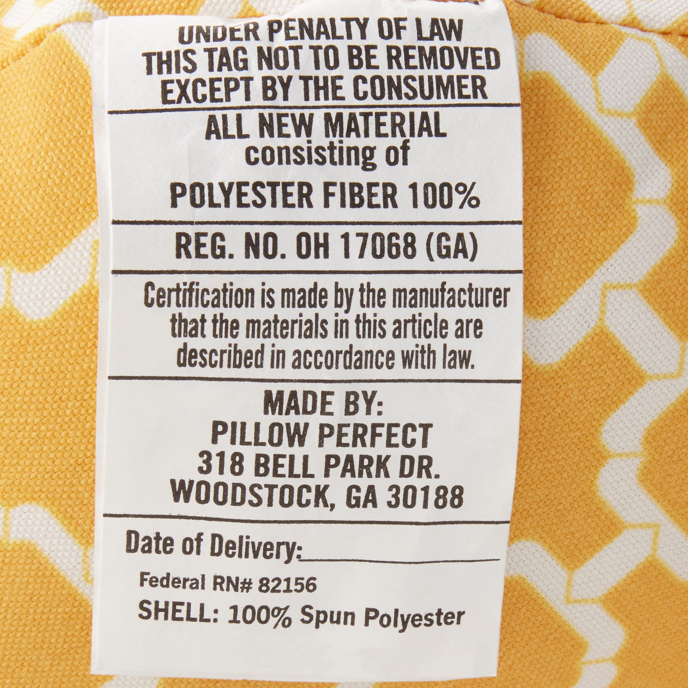 Pillow Perfect on patio wicker chair showing color pop and outdoor use