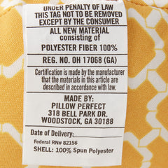 Pillow Perfect on patio wicker chair showing color pop and outdoor use