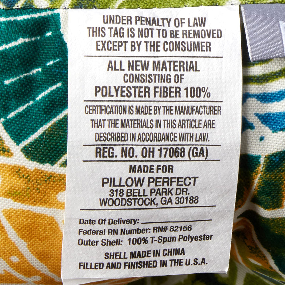 Pillow Perfect Omnia Lagoon cushion in patio setting on wicker loveseat showing stylish comfort