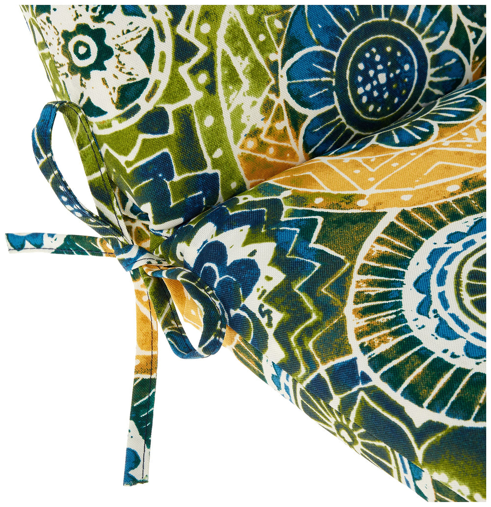 Pillow Perfect Omnia Lagoon on patio chair demonstrating secured ties and outdoor use
