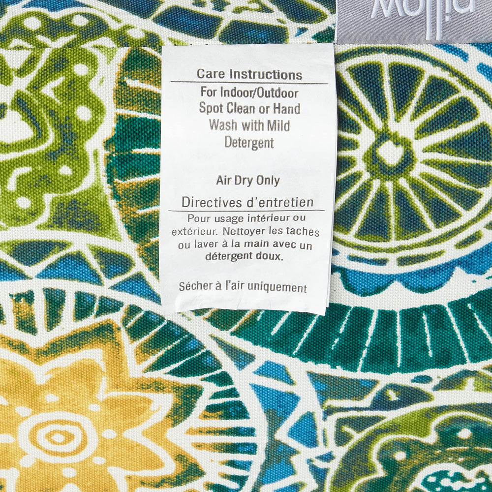 Pillow Perfect Omnia Lagoon placed beside ruler for size comparison and fit guidance