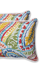 Pillow Perfect placed on patio chair illustrating weather-resistant color pop