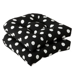 Pillow Perfect front view of black polka dot round cushion showing bold pattern and visual appeal