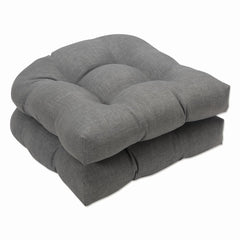 Pillow Perfect front view of two graphite gray cushions showing neat tufting and rounded corners for versatile styling