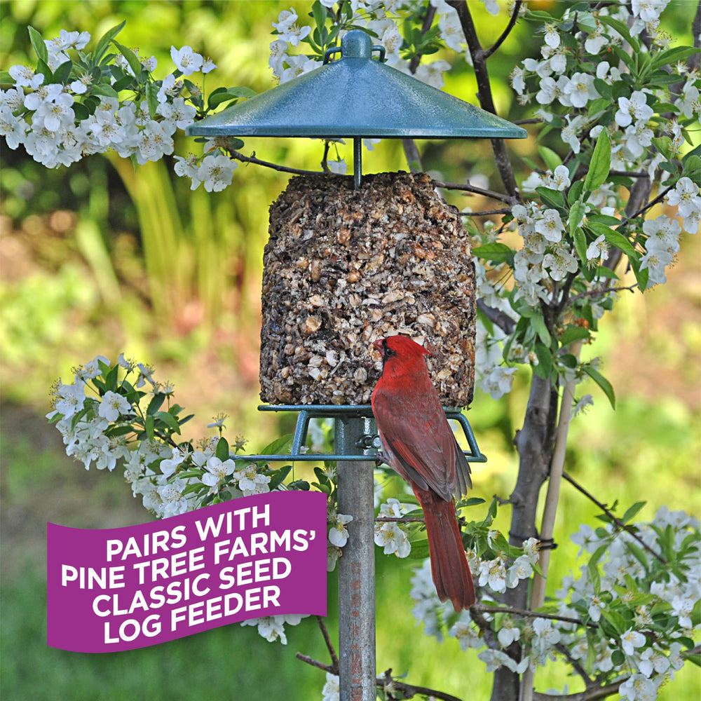 Pine Tree Farms log held in hand to show 28 oz scale and quick-hang convenience