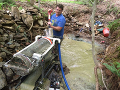 Pioneer Paydirt in a gold pan being washed, Pioneer Paydirt aids easy panning practice