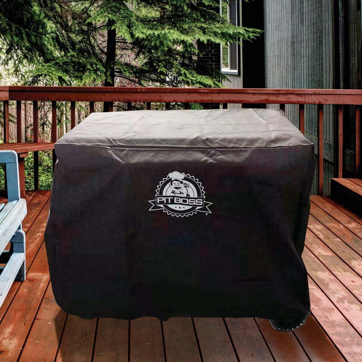 Pit Boss cover beside chair showing scale, ensures full-length protection