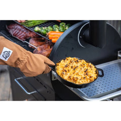 Pit Boss gloves in use lifting hot grill grate demonstrating safe handling benefit