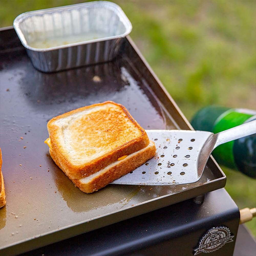 Pit Boss griddle in use at a tailgate cooking breakfast for fast outdoor meals