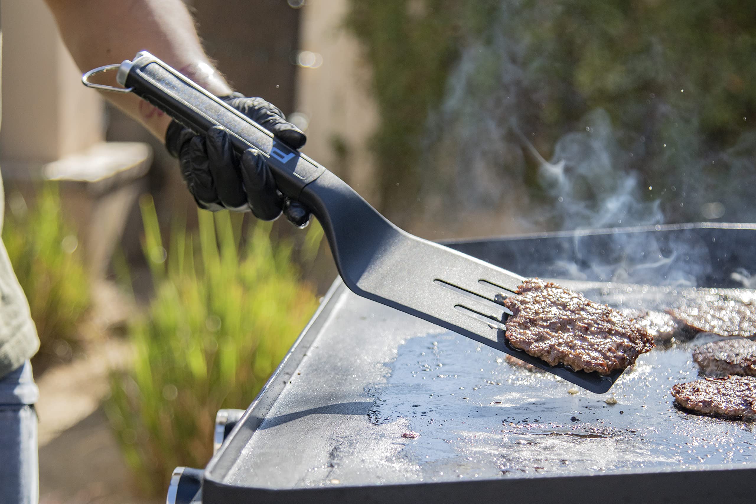 Pit Boss restaurant-style scraper blade close-up for chopping and scraping