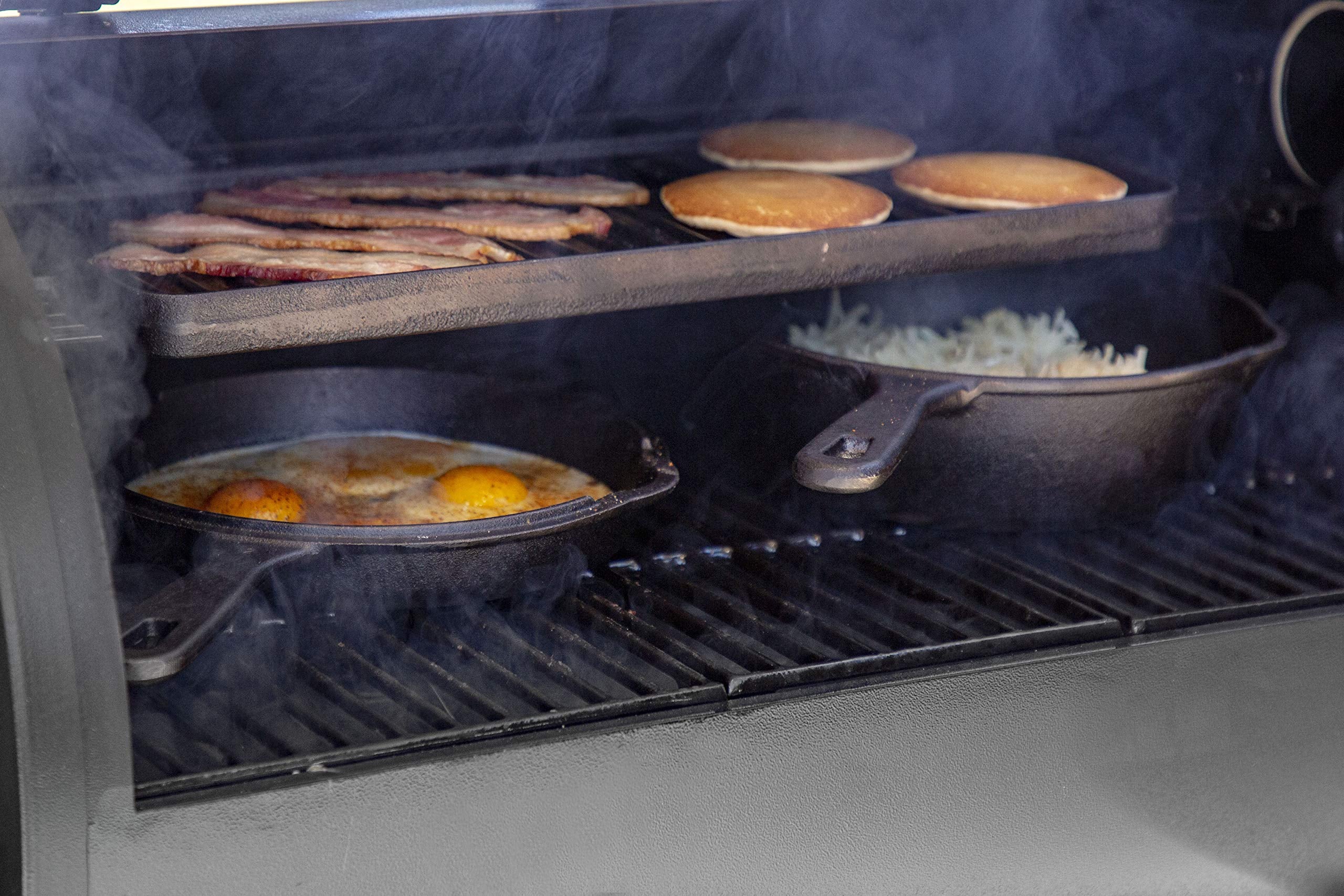 Pit Boss griddle next to utensils demonstrating 10x20 size and 200 square inch capacity