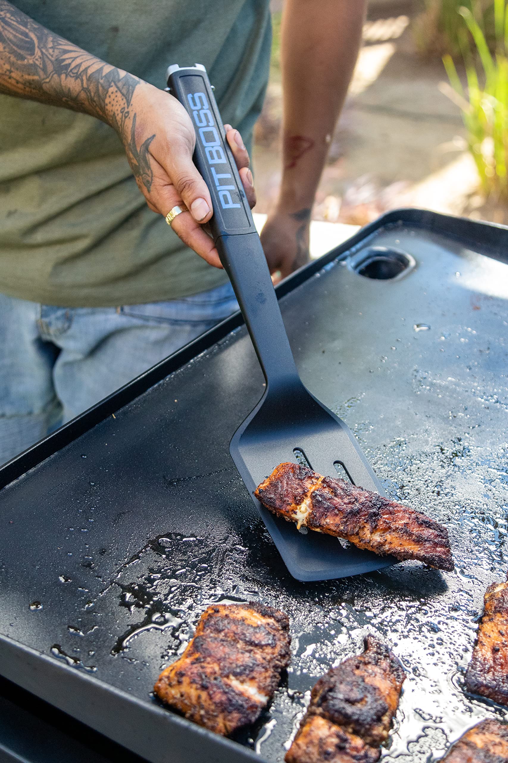 Pit Boss solid turner detail showing sturdy edge for lifting heavy food
