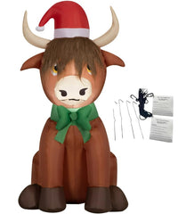 PITCHING PIGEON Highlander Cow front view showing festive LED lighting and charm