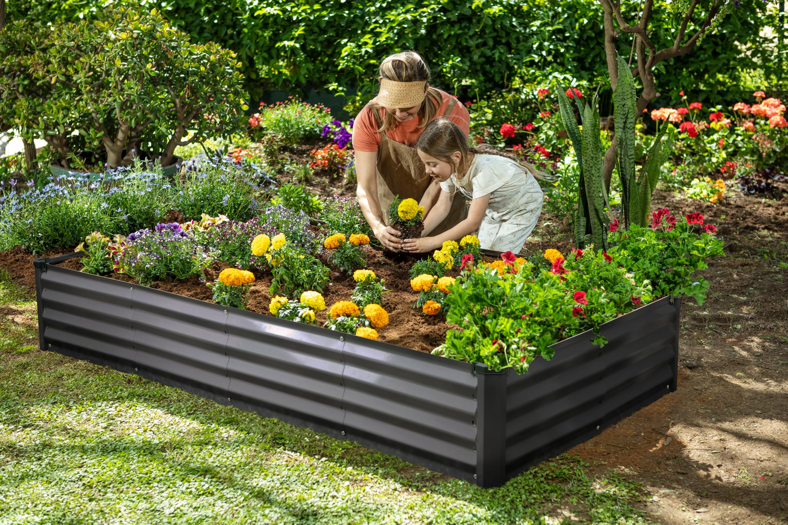 Plant & Plot dark gray raised bed on patio with flowers showing stylish curb appeal and compact footprint