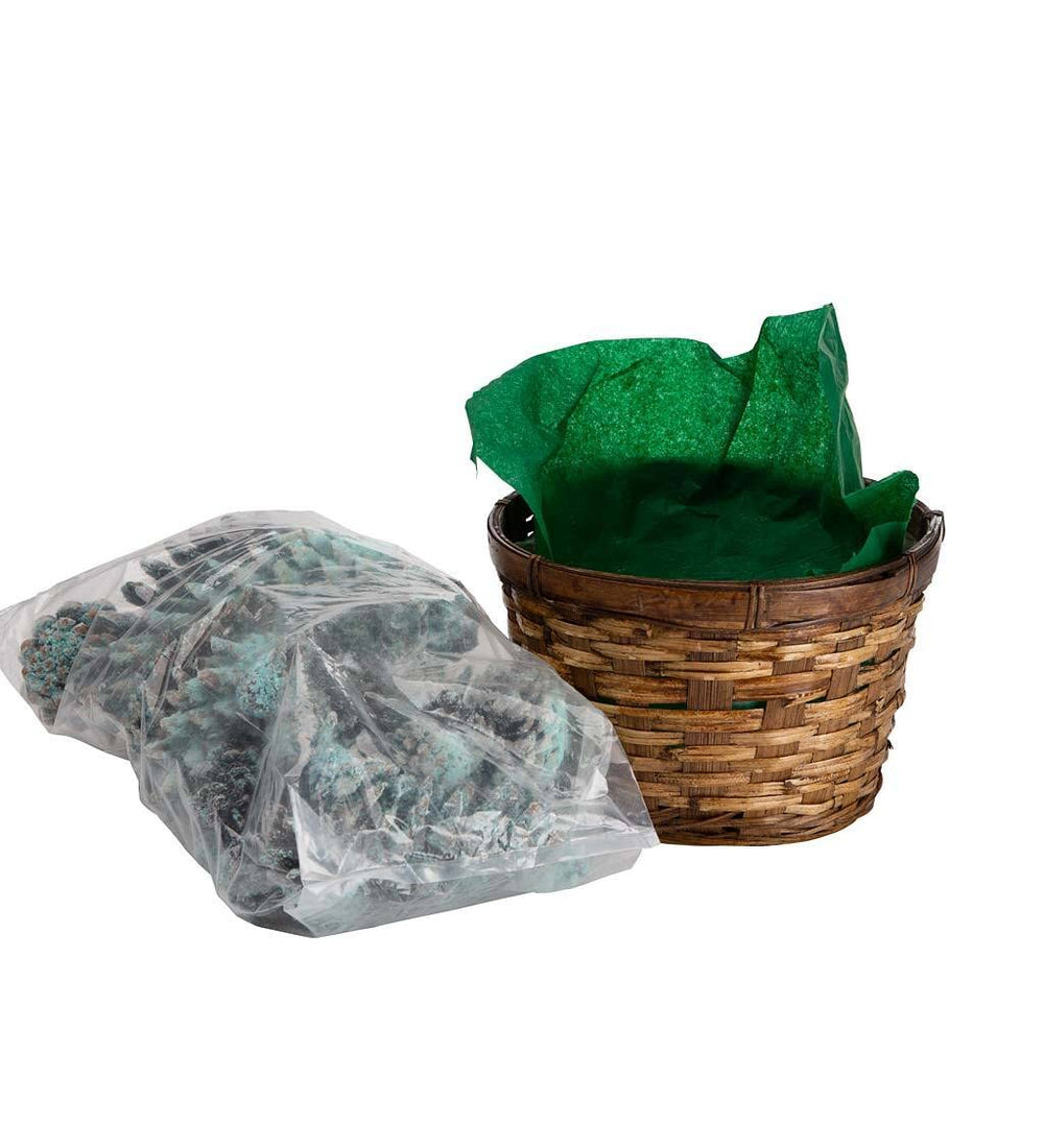 Outdoor fire pit burning Plow & Hearth cones producing blue and green flame accents