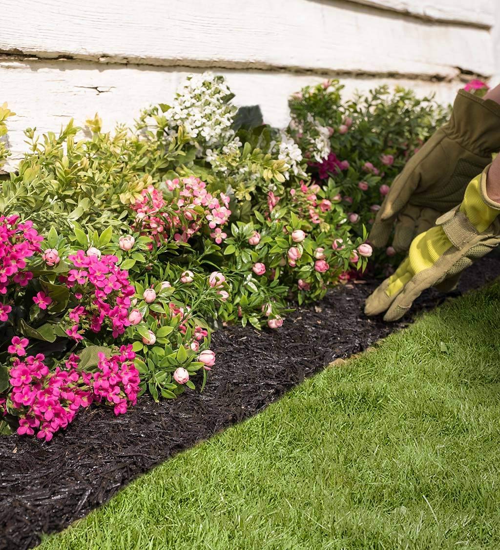 Plow & Hearth installed along a flower bed illustrating tidy landscape aesthetic benefit