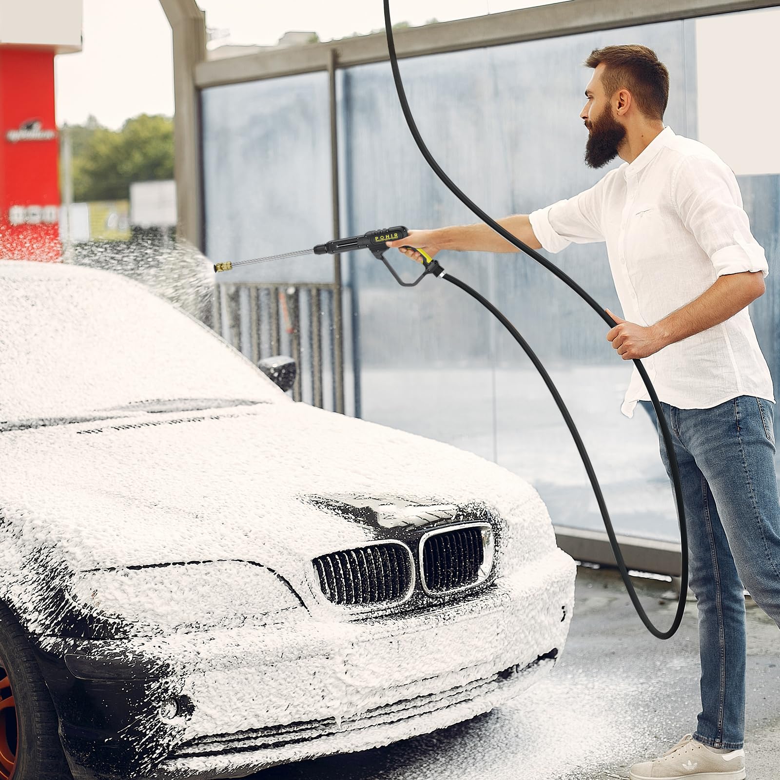 POHIR pressure washer kit in use cleaning a driveway to show effective outdoor grime removal