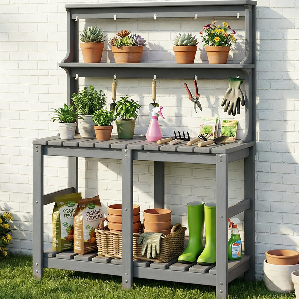 Polyhouz front view of grey potting bench showing three tiers and workspace, durable outdoor use
