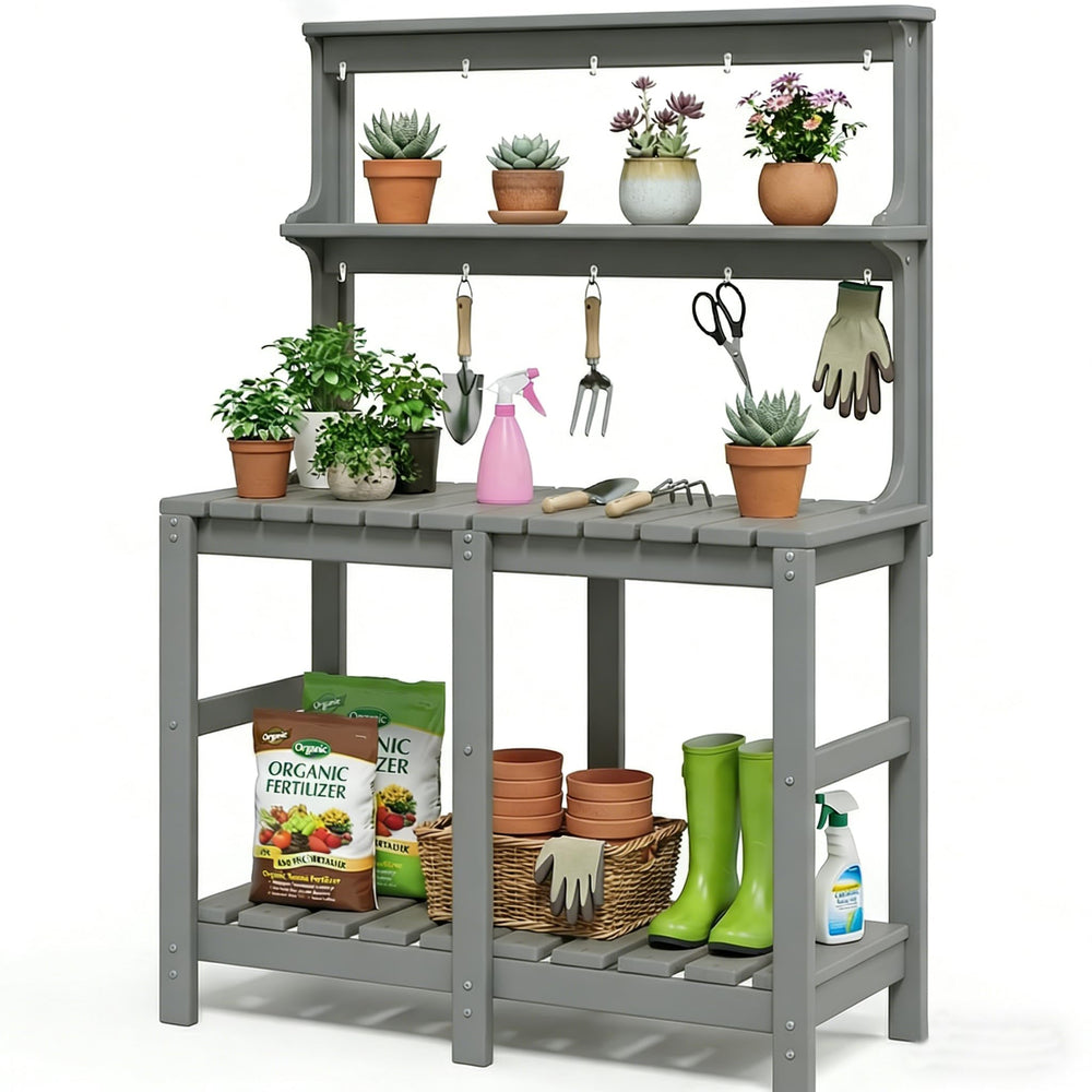 Polyhouz bench beside common gardening tools illustrating scale and ergonomic working height