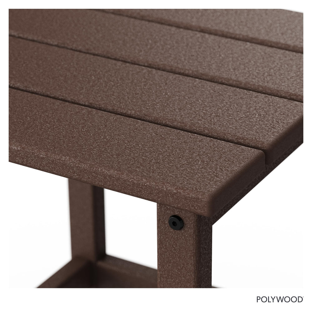 Outdoor lifestyle shot of Polywood mahogany side table holding a drink showing durability