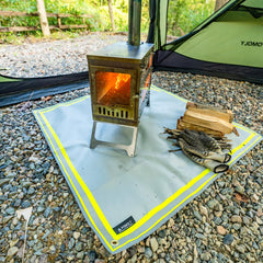 POMOLY mat under a small fire pit protecting lawn and preventing scorching