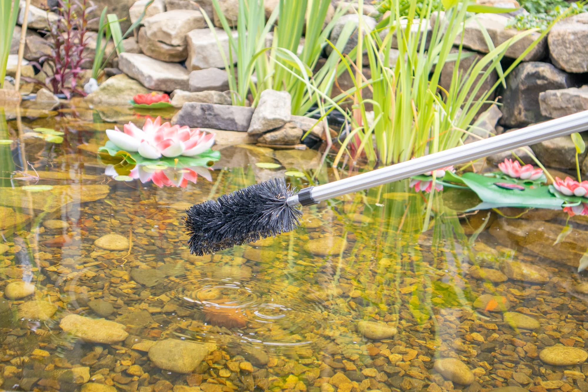 Pond H2o extended telescoping pole being used to reach pond corners safely