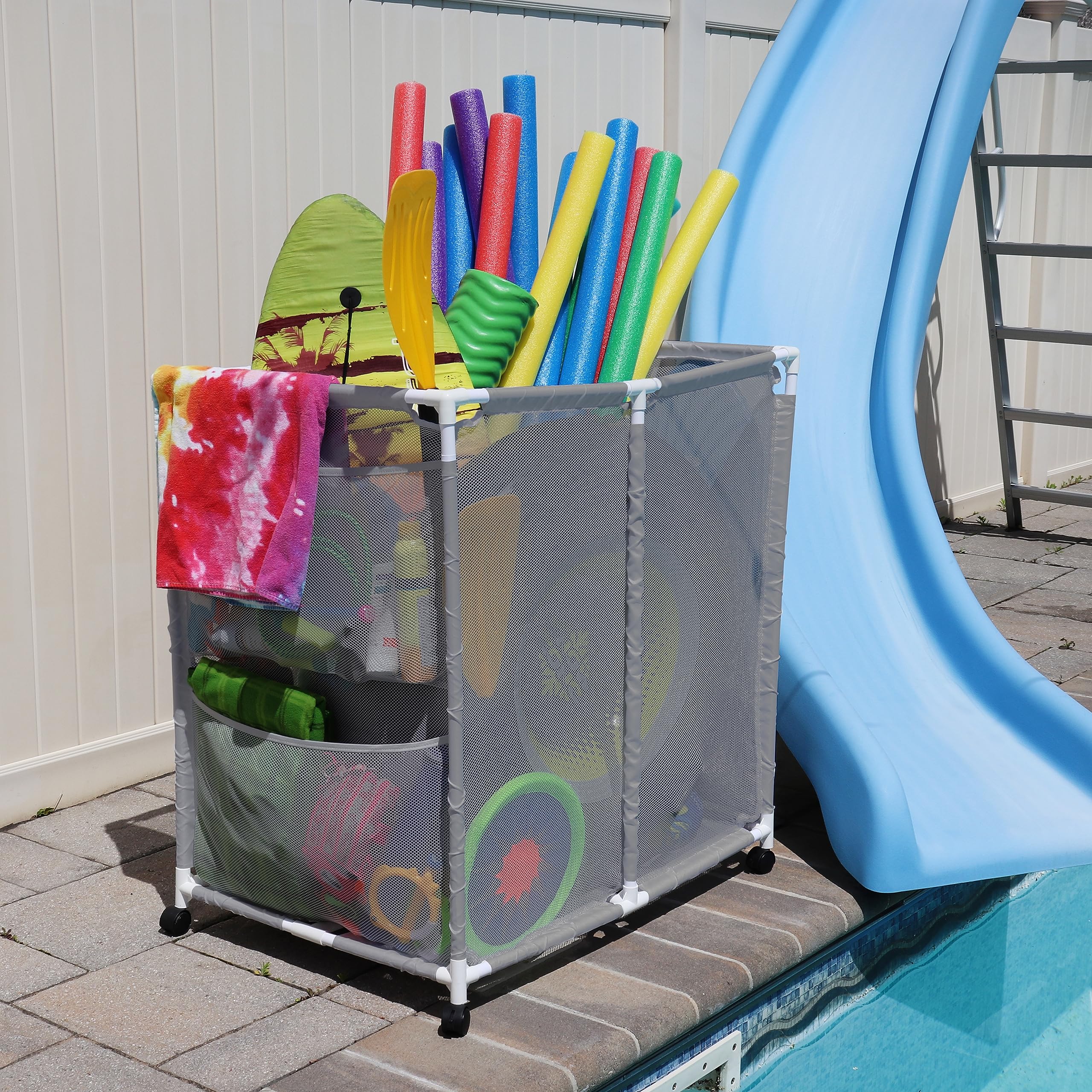 Pool Bins positioned poolside with toys inside showing tidy, ready-to-use storage