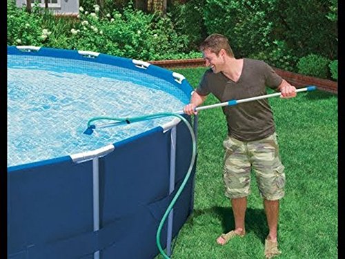 Pool Supply Town lifestyle shot of vacuum cleaning a backyard spa for quick maintenance